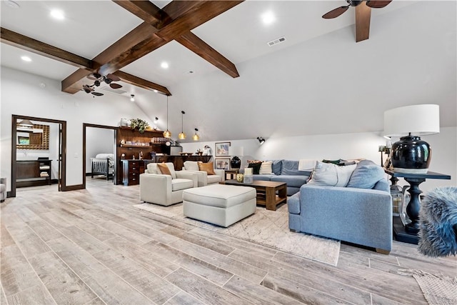 living room with light hardwood / wood-style flooring and ceiling fan