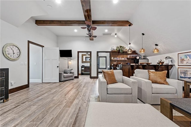 living room featuring lofted ceiling with beams, ceiling fan, bar, and light hardwood / wood-style floors