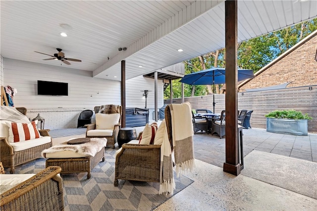 view of patio featuring an outdoor living space and ceiling fan