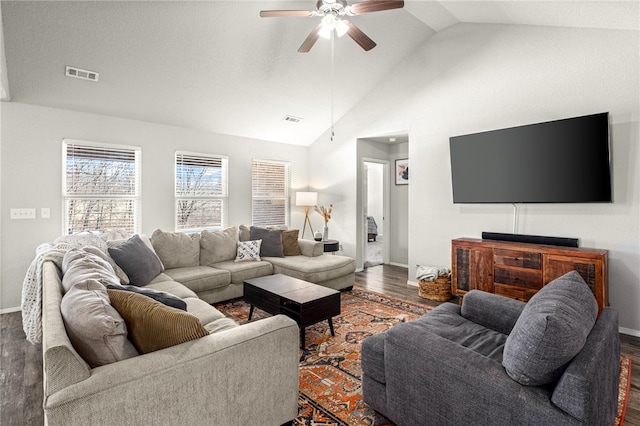 living room with ceiling fan, dark hardwood / wood-style floors, and lofted ceiling