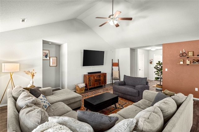 living room with ceiling fan, high vaulted ceiling, and dark hardwood / wood-style flooring