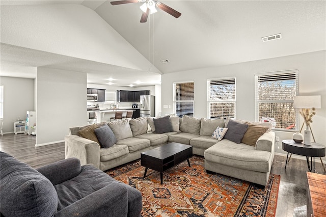 living room featuring sink, high vaulted ceiling, dark hardwood / wood-style flooring, and ceiling fan