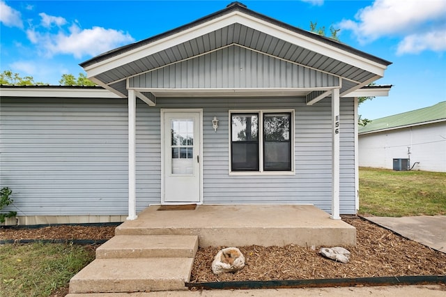 view of exterior entry featuring central AC unit