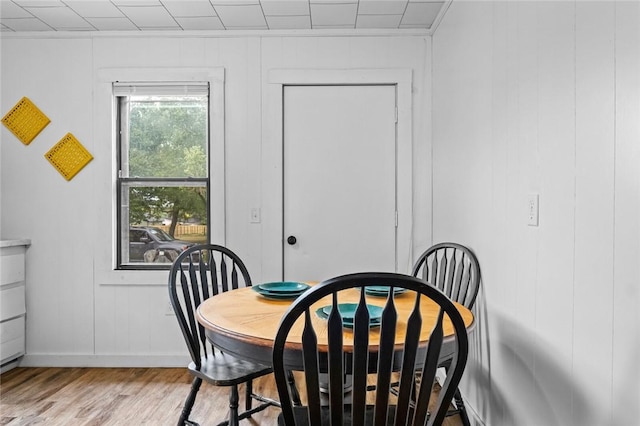 156 Main, Colcord, OK 74338 - dining room with wood finished floors, baseboards, and a decorative wall
