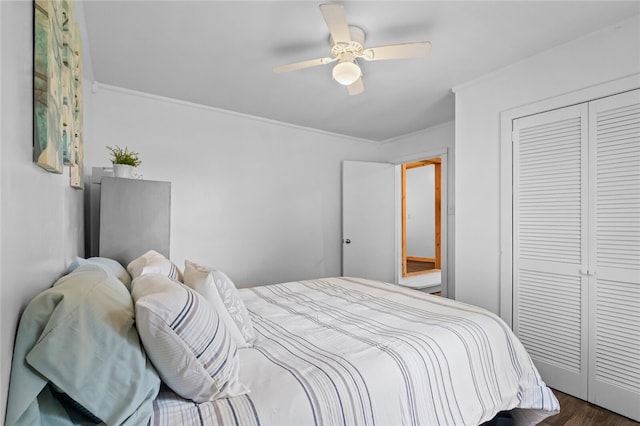 bedroom with ceiling fan, hardwood / wood-style floors, and a closet