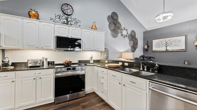 kitchen featuring stainless steel appliances, dark wood-style flooring, a sink, and white cabinetry