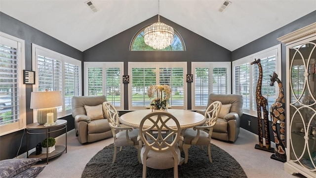 dining room with a healthy amount of sunlight, an inviting chandelier, and visible vents