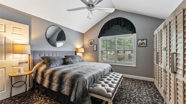 bedroom with lofted ceiling, baseboards, dark carpet, and ceiling fan