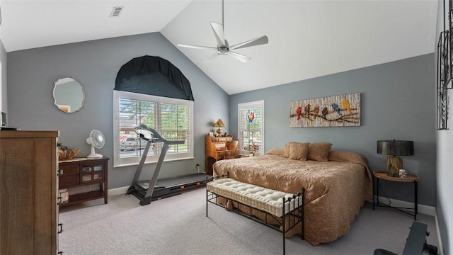 bedroom featuring light colored carpet, visible vents, vaulted ceiling, ceiling fan, and baseboards