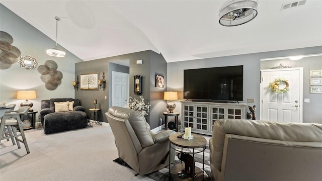 living area featuring visible vents, vaulted ceiling, and light colored carpet