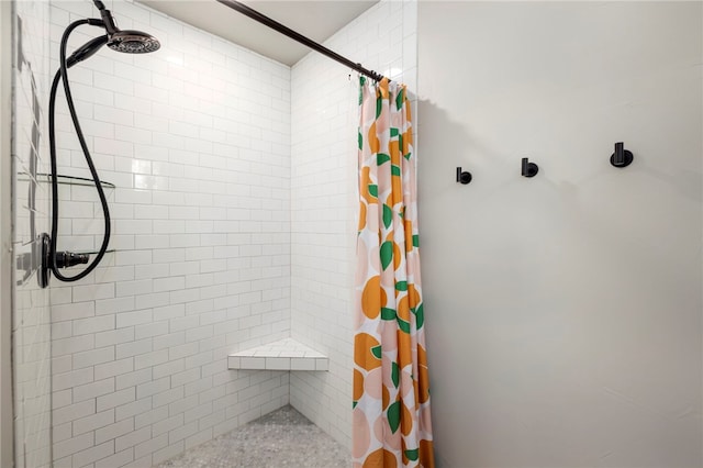 full bath featuring a tile shower