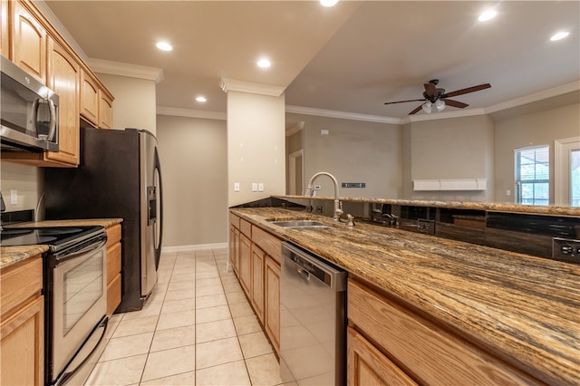 kitchen with ceiling fan, crown molding, dark stone countertops, stainless steel appliances, and sink