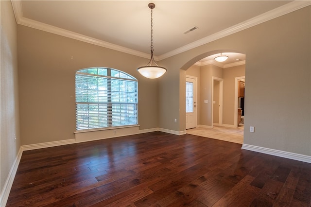 unfurnished room with crown molding and hardwood / wood-style flooring