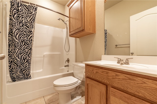 full bathroom with tile patterned floors, shower / tub combo with curtain, vanity, and toilet