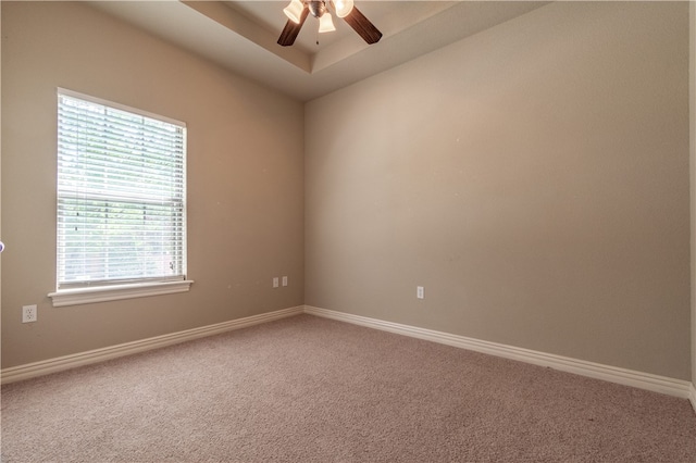 empty room featuring ceiling fan and carpet flooring