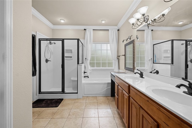 bathroom featuring ornamental molding, dual bowl vanity, and separate shower and tub