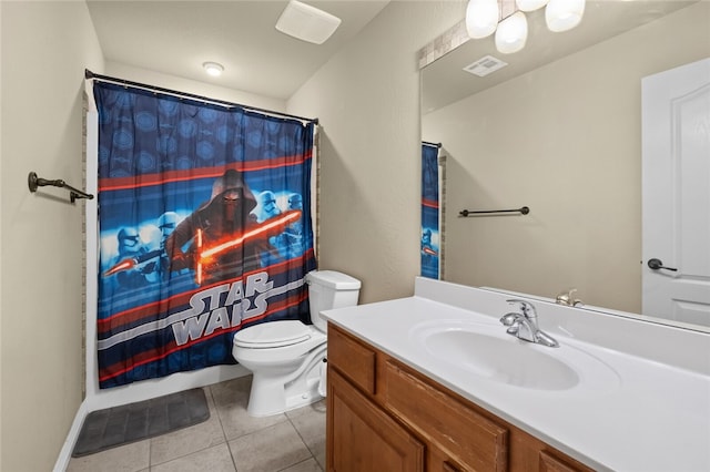 bathroom featuring tile patterned floors, vanity, and toilet