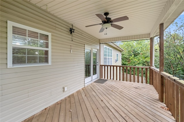 wooden terrace featuring ceiling fan