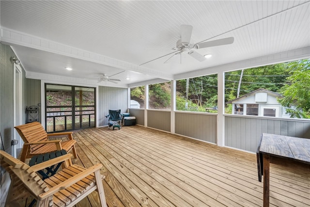 sunroom with a wealth of natural light and ceiling fan