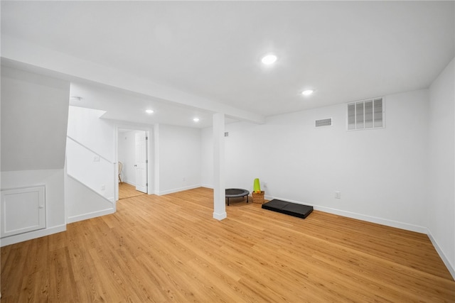 exercise area with light hardwood / wood-style floors