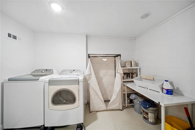 washroom featuring washing machine and dryer