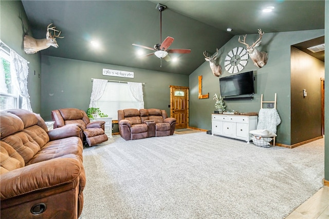 living room featuring plenty of natural light, hardwood / wood-style floors, vaulted ceiling, and ceiling fan