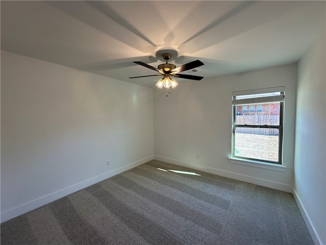 empty room with carpet flooring and ceiling fan