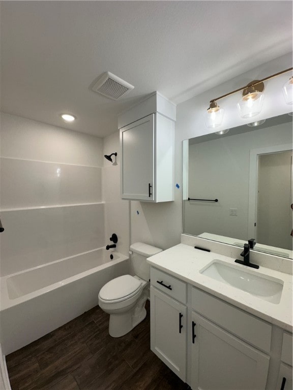 full bathroom with toilet, vanity, tub / shower combination, and hardwood / wood-style flooring