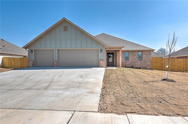 ranch-style house featuring driveway, fence, roof with shingles, a garage, and brick siding