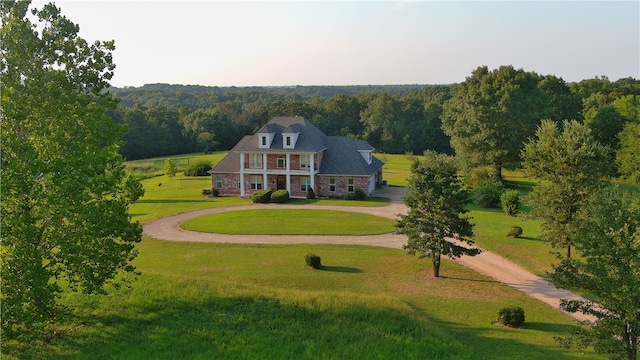 view of property's community with a lawn