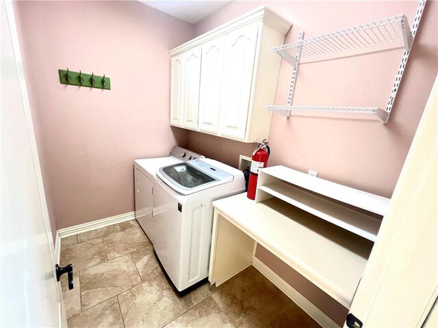 clothes washing area featuring cabinets, independent washer and dryer, and light tile patterned floors