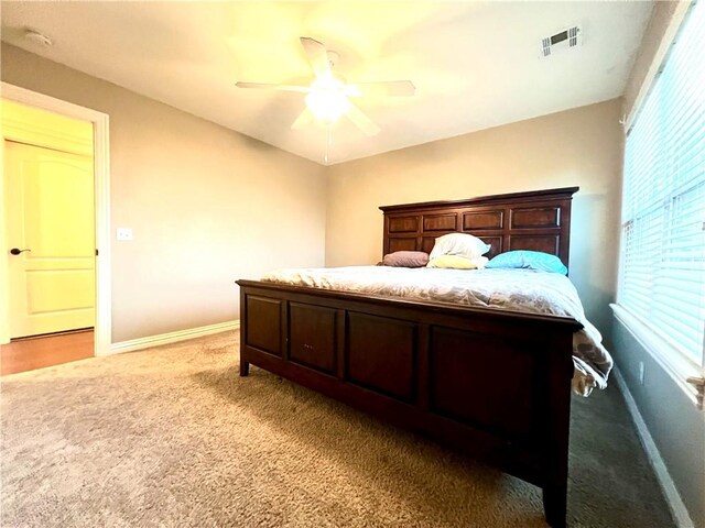 carpeted bedroom featuring ceiling fan