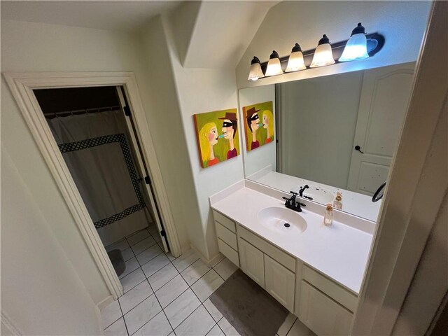 bathroom with tile patterned flooring and vanity