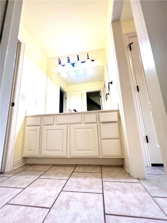 bathroom with tile patterned floors