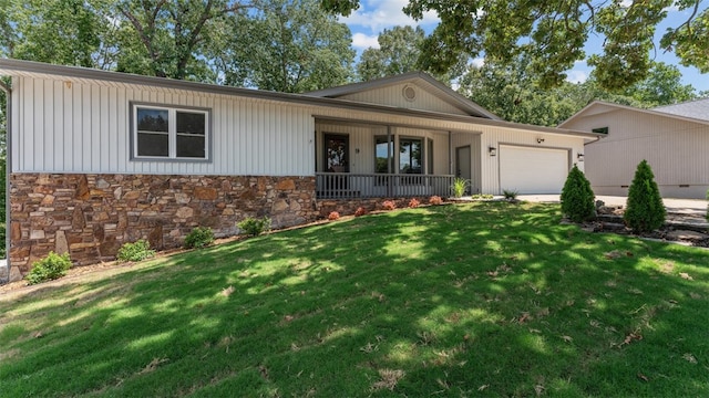 single story home with a front yard, a garage, and a porch