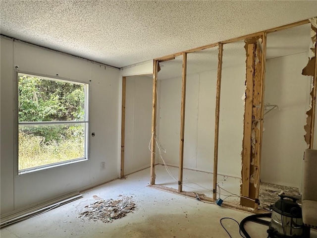 11121 Wolf Track Rd, Summers, AR 72769 - unfurnished bedroom with a textured ceiling