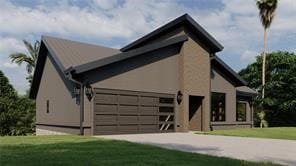 view of front facade featuring a front lawn and a garage