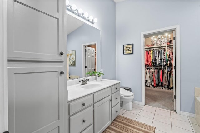 bathroom with tile patterned floors, toilet, and vanity