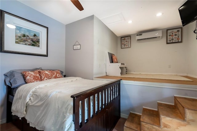 bedroom featuring an AC wall unit and ceiling fan