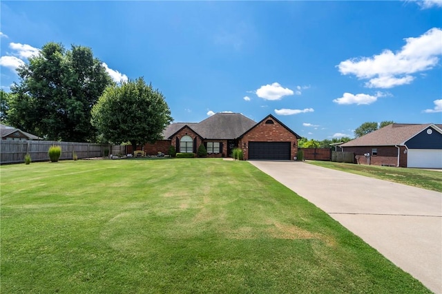 view of front of house with a garage and a front lawn