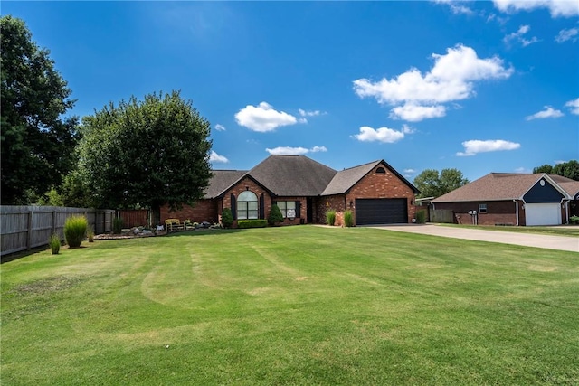 view of front of house featuring a front lawn and a garage