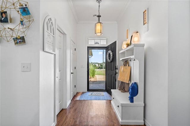 interior space with dark wood-type flooring and crown molding