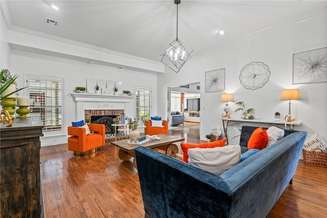 living room with a fireplace, hardwood / wood-style floors, and a wealth of natural light