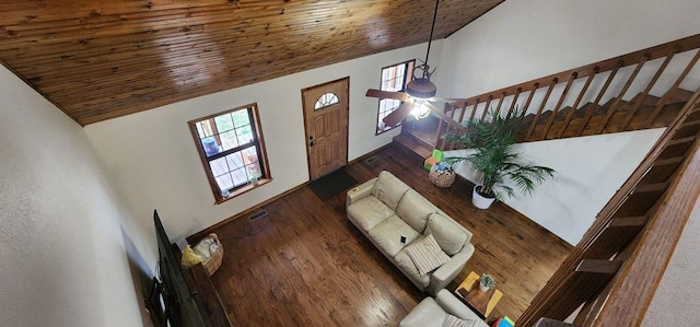 living room featuring ceiling fan, dark hardwood / wood-style floors, high vaulted ceiling, and wooden ceiling