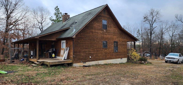 view of home's exterior featuring a wooden deck