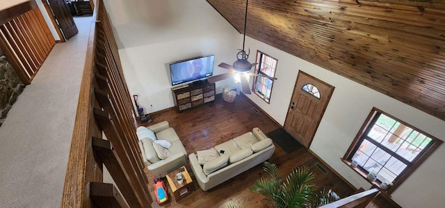 living room with high vaulted ceiling, wood ceiling, and dark wood-type flooring