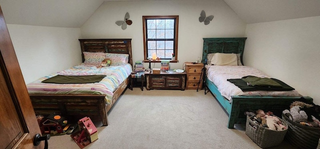 bedroom featuring carpet and vaulted ceiling