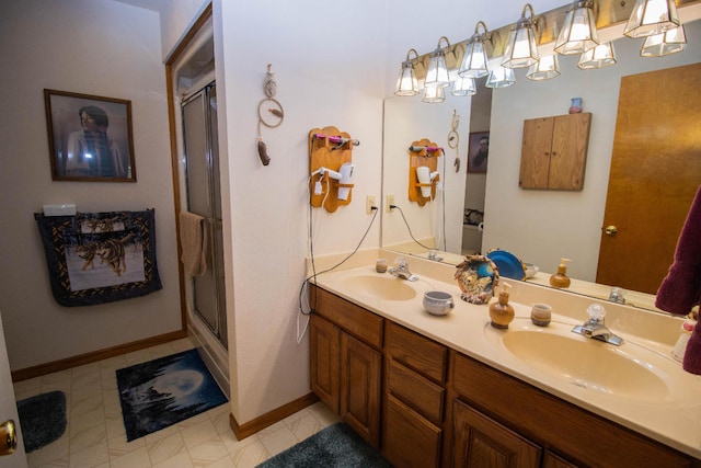 bathroom featuring a shower with door, tile patterned floors, and vanity