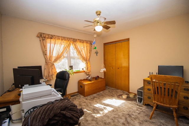 carpeted home office with ceiling fan