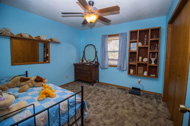 carpeted bedroom with a closet and ceiling fan